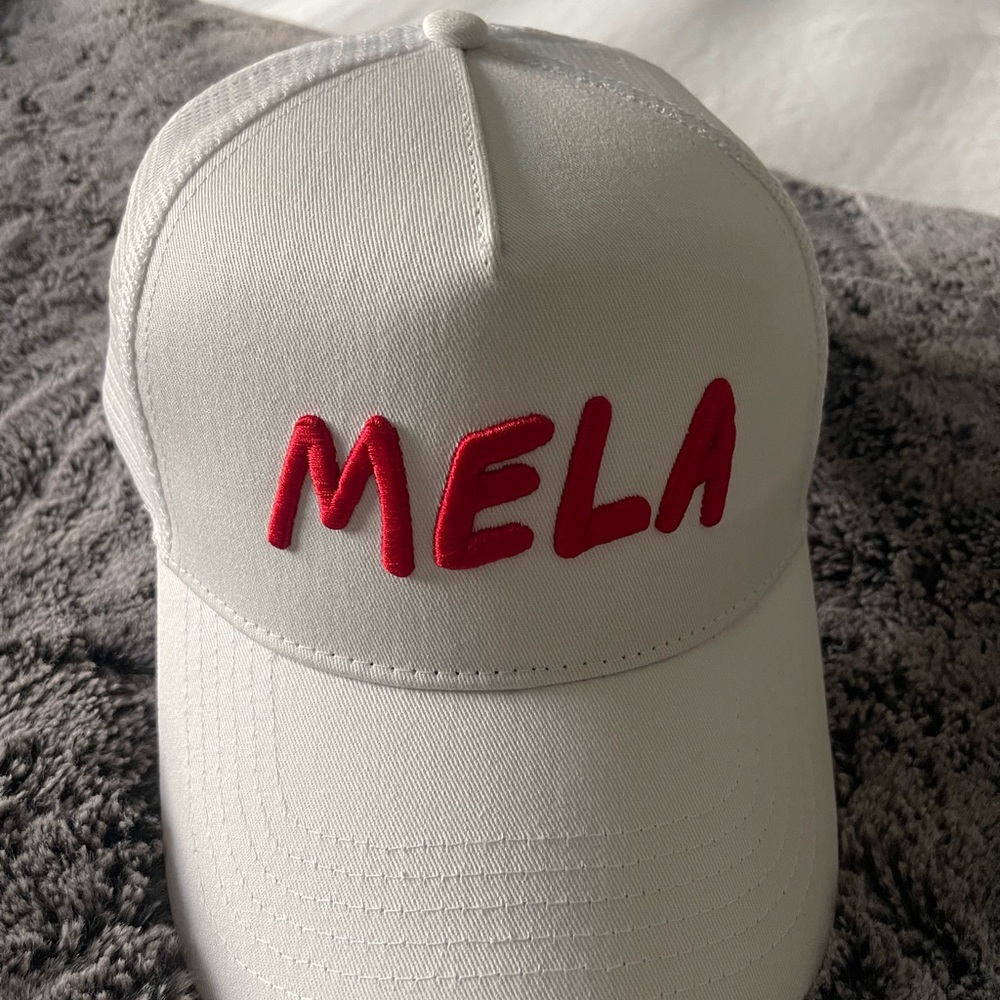 White Cap with Red MELA Embroidery